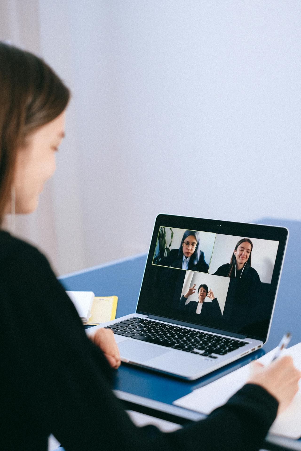 a woman looking at other participants in a video conference